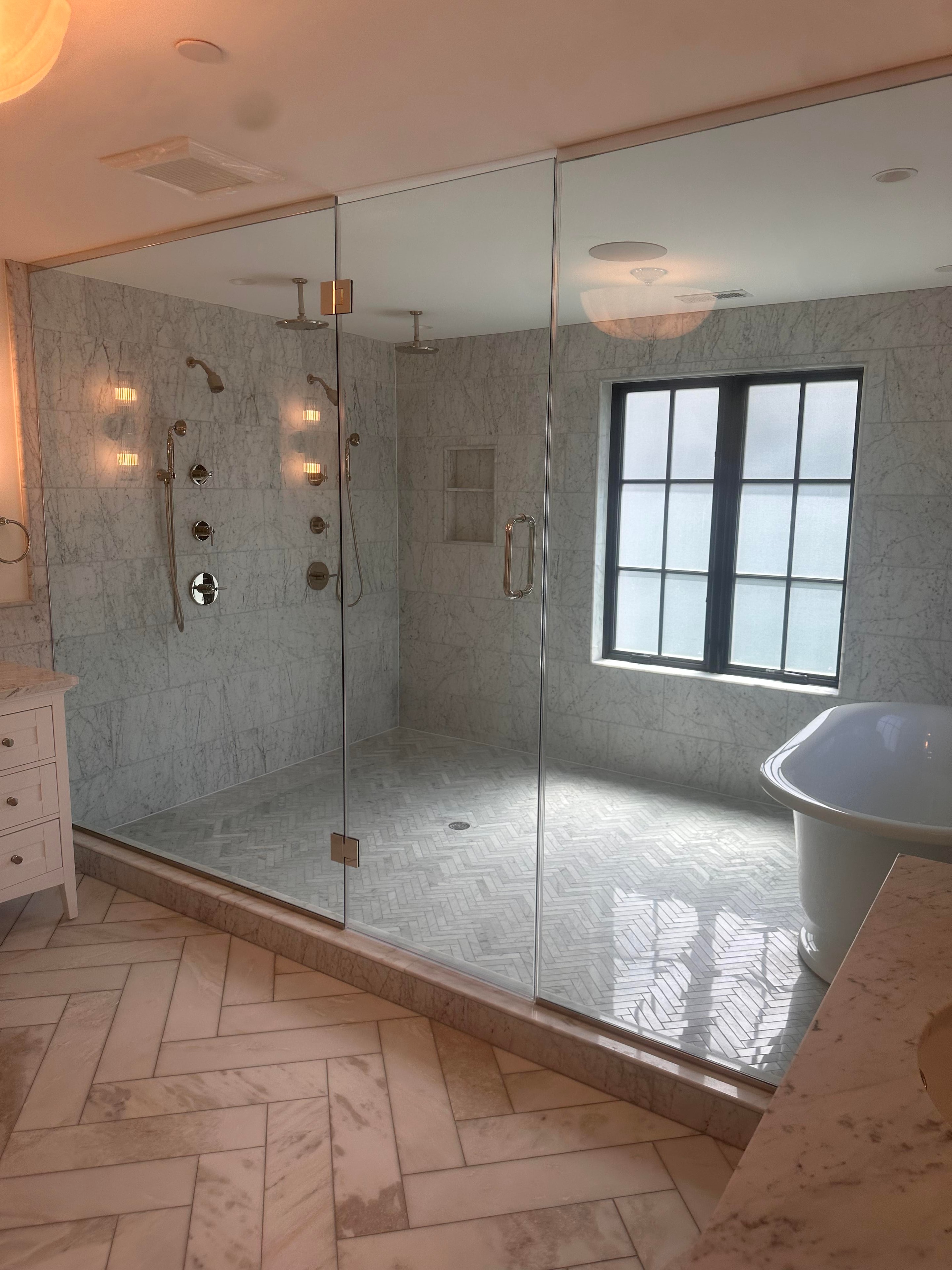 Luxury bathroom remodel with black and white vanity