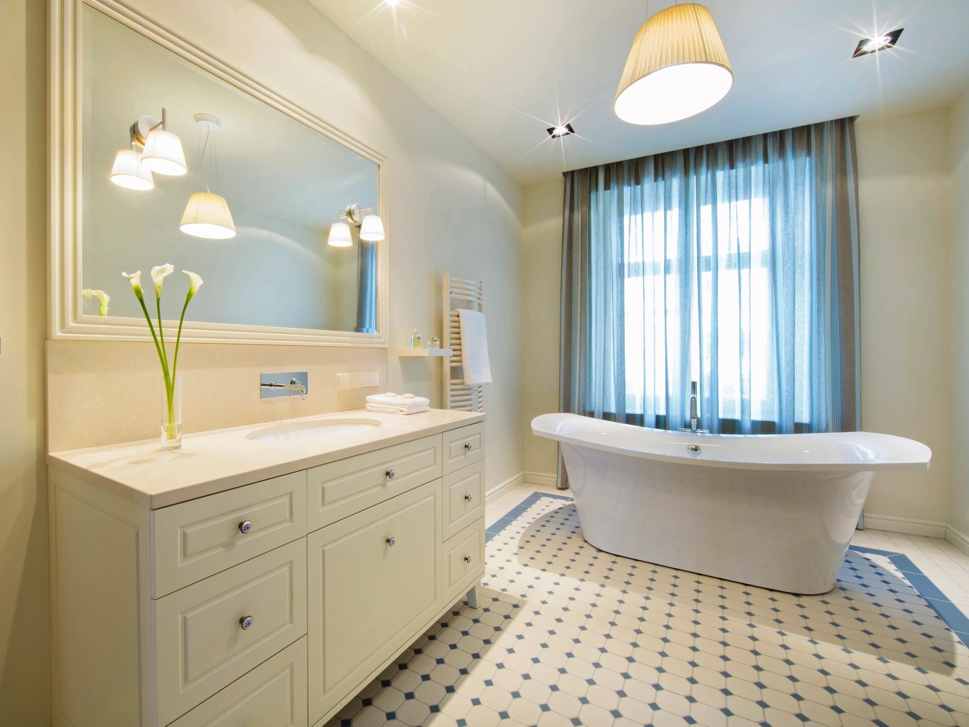 Spa bathroom with freestanding tub and marble tile